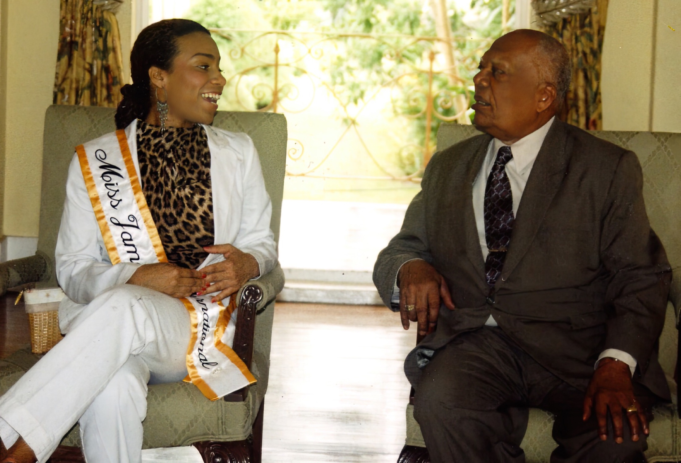 Daisi Pollard in conversation with Sir Howard Cooke, then Governor-General of Jamaica.